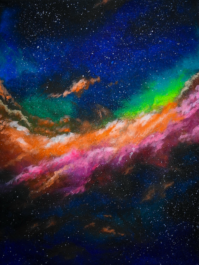 Colorful nebula with vibrant hues of orange, green, and pink against a starry space background.